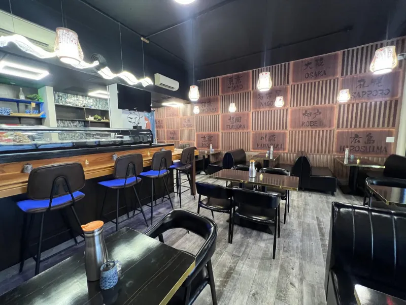 Sleek sushi bar with high stools at Miyazaki Sushi & IZAKAYA, a Japanese Restaurant in Kailua-Kona.