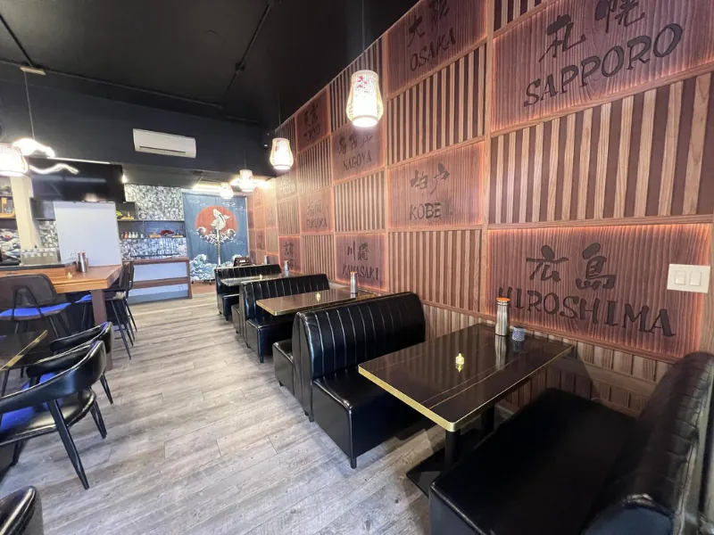 Wooden wall panels with Japanese city names at Miyazaki Sushi & IZAKAYA, a Japanese Restaurant in Kailua-Kona.